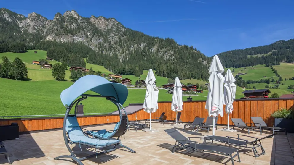 Hotel Alphof Alpbach Terrace Loungers [4]