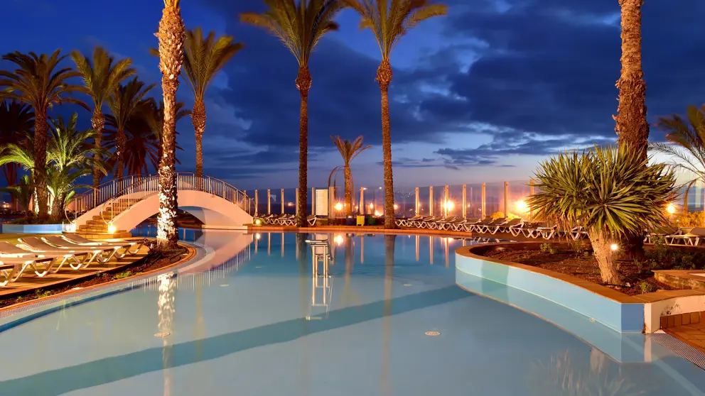 Pestana Grand Premium Ocean Resort Funchal Outdoor Pool Night [3]