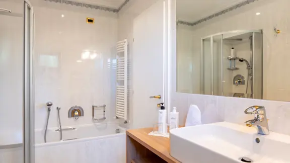 Bathroom with bath & shower