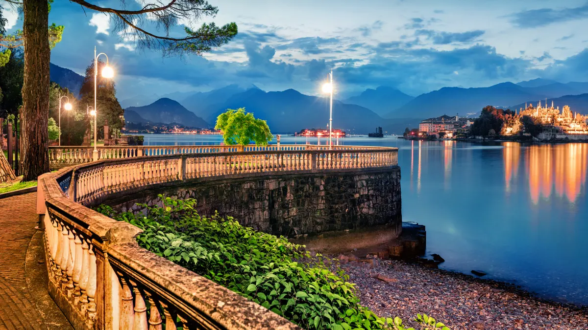 Stresa Lake Maggiore View Of Isola Bella From The Lakeside Promenade At Sunset