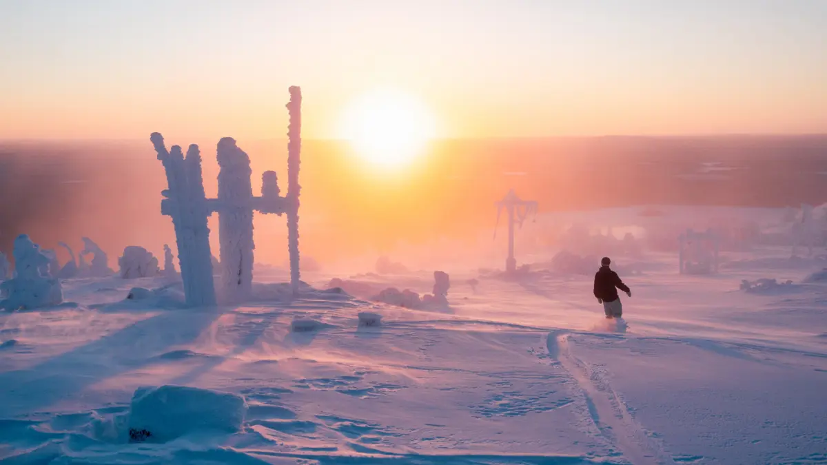 Snowboarding Next To Huttu Ukko Statue