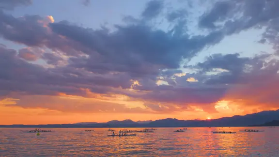 Rowers on Lake Garda at Sunset