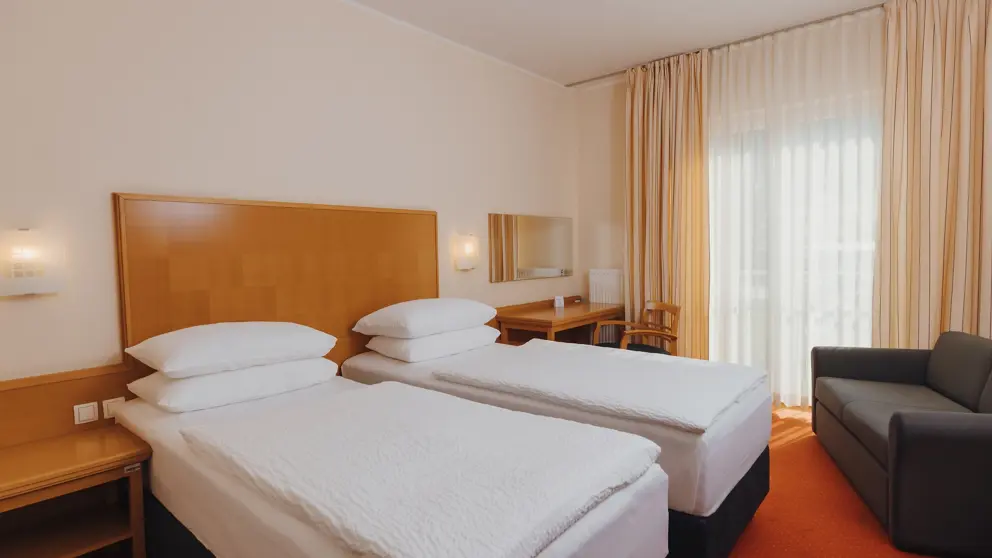 Ramada Hotel And Suites Kranjska Gora Typical Bedroom [1]